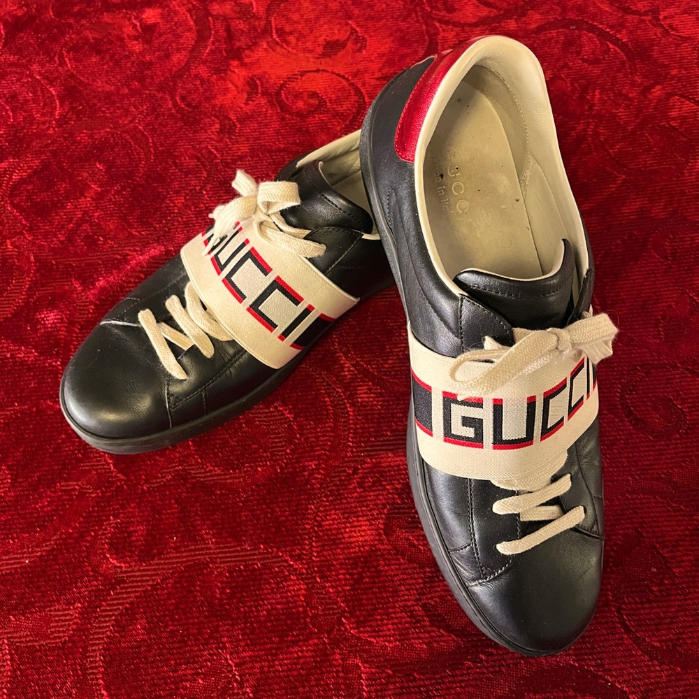 Gucci Black Leather Sneakers with Beige Logo Strap and Red Heel Accent